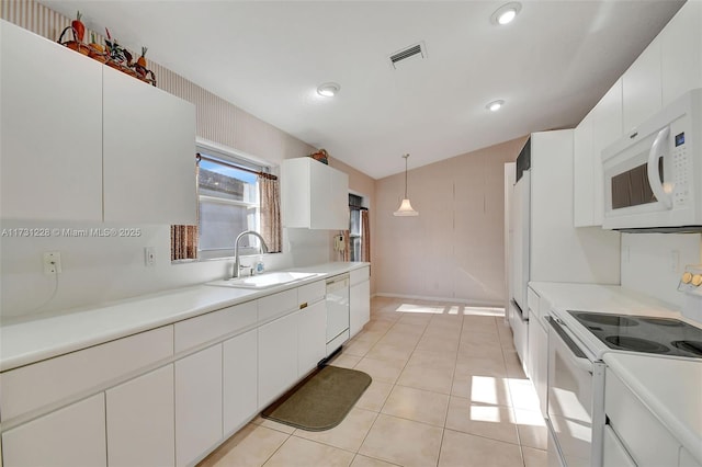 12915 Coral Lakes Dr, Boynton Beach, FL 33437 - kitchen featuring white appliances, a sink, white cabinets, lofted ceiling, and recessed lighting