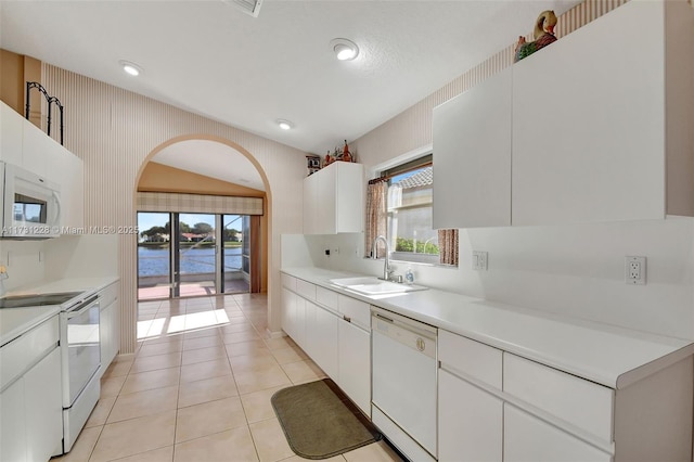 12915 Coral Lakes Dr, Boynton Beach, FL 33437 - kitchen with white appliances, a sink, light countertops, white cabinetry, and plenty of natural light