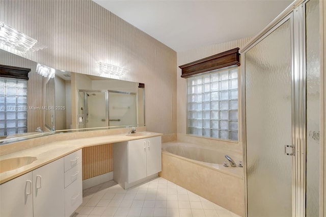 12915 Coral Lakes Dr, Boynton Beach, FL 33437 - bathroom featuring a stall shower, double vanity, a garden tub, tile patterned flooring, and wallpapered walls