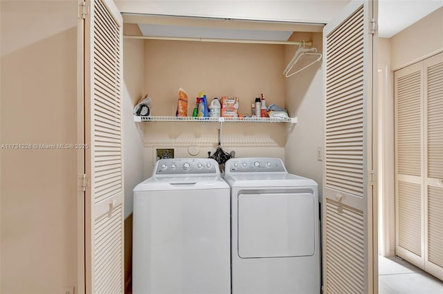 12915 Coral Lakes Dr, Boynton Beach, FL 33437 - washroom featuring washing machine and clothes dryer and light tile patterned floors