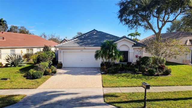 12915 Coral Lakes Dr, Boynton Beach, FL 33437 - ranch-style home featuring a garage, stucco siding, decorative driveway, and a front yard