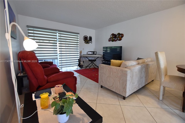 living room with light tile patterned floors and a textured ceiling