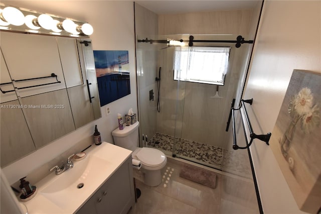 bathroom with vanity, toilet, an enclosed shower, and tile patterned flooring