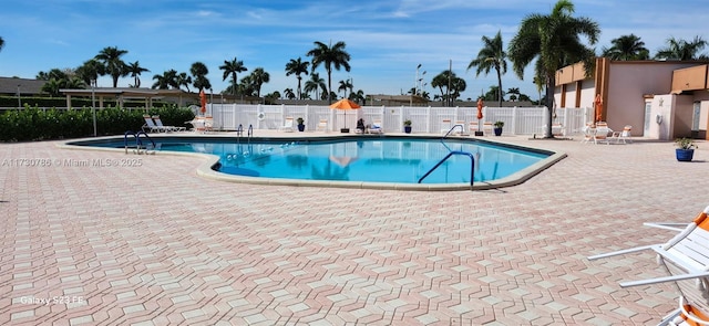 view of swimming pool with a patio area