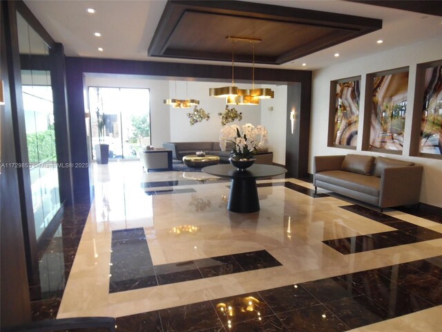 dining room with hardwood / wood-style flooring, a drop ceiling, and built in features