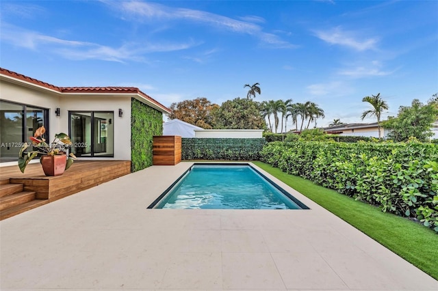 view of pool with fence, a fenced in pool, and a patio