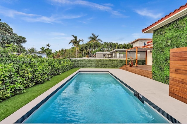 view of pool featuring a fenced in pool and a fenced backyard