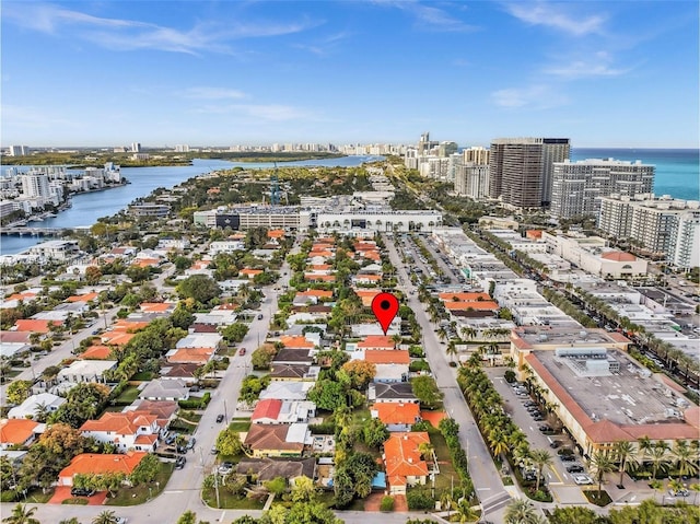 drone / aerial view with a view of city and a water view