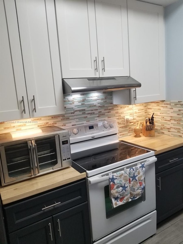 kitchen with backsplash, white electric range oven, butcher block counters, and white cabinets