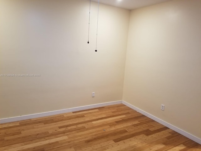 unfurnished room featuring light hardwood / wood-style flooring