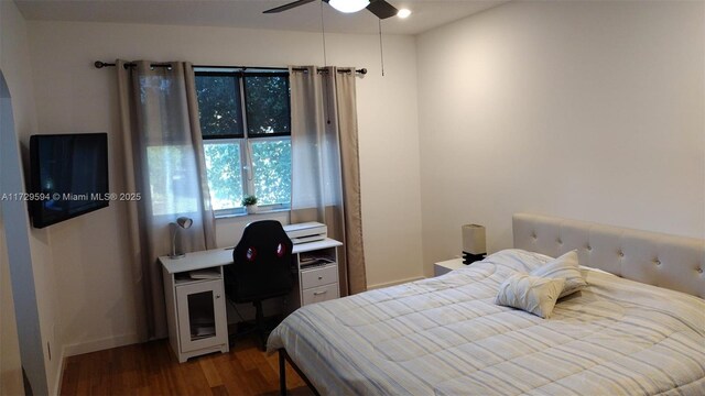 bedroom with hardwood / wood-style flooring and ceiling fan