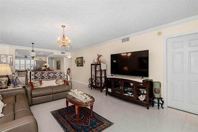 tiled living room with an inviting chandelier, ornamental molding, and a textured ceiling