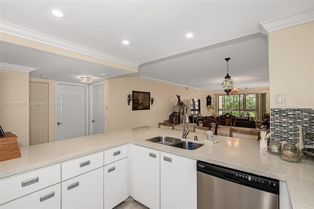 kitchen with sink, ornamental molding, white cabinets, stainless steel dishwasher, and kitchen peninsula