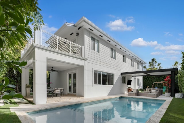 back of house featuring a patio, a balcony, french doors, ceiling fan, and an outdoor living space