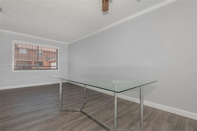 unfurnished office featuring ornamental molding, dark hardwood / wood-style flooring, and a textured ceiling