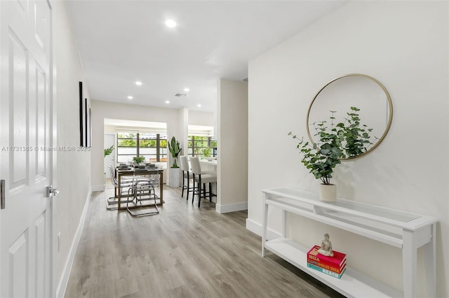 corridor featuring light hardwood / wood-style floors