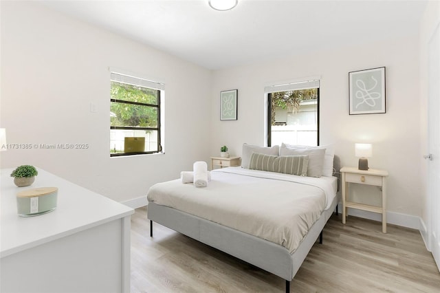 bedroom with light wood-type flooring