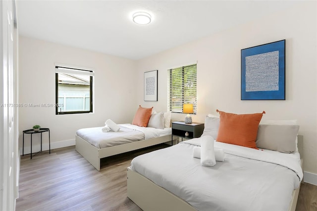 bedroom with light hardwood / wood-style flooring