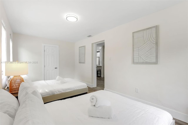 bedroom featuring wood-type flooring