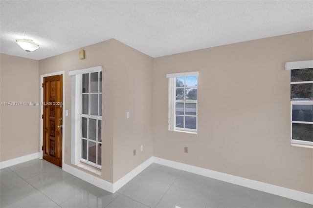 2050 NE 140th St Unit 1, North Miami Beach, FL 33181 - unfurnished room with baseboards and tile patterned flooring