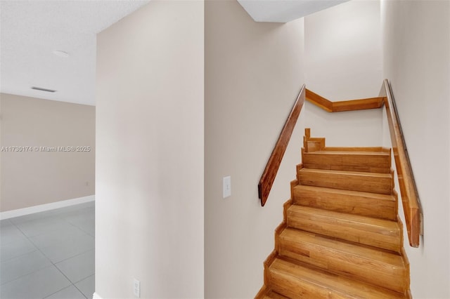 2050 NE 140th St Unit 1, North Miami Beach, FL 33181 - stairway with baseboards and tile patterned flooring