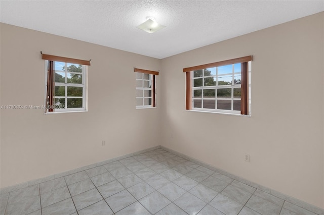 empty room with a textured ceiling