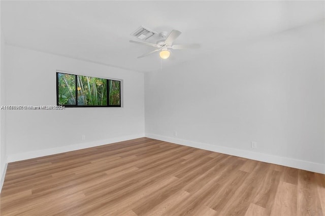 spare room with light hardwood / wood-style floors and ceiling fan