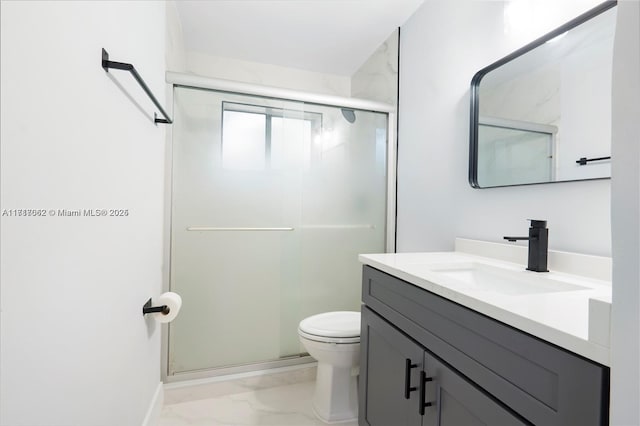 bathroom featuring vanity, toilet, and walk in shower