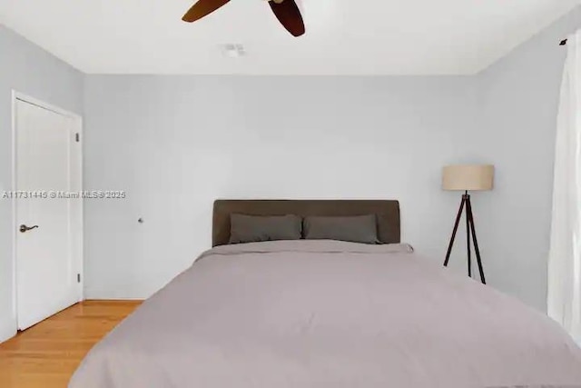 bedroom featuring hardwood / wood-style floors and ceiling fan