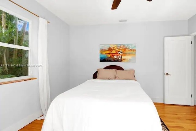 bedroom featuring ceiling fan and light hardwood / wood-style floors