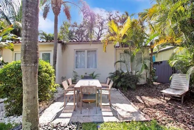 rear view of property featuring a patio area