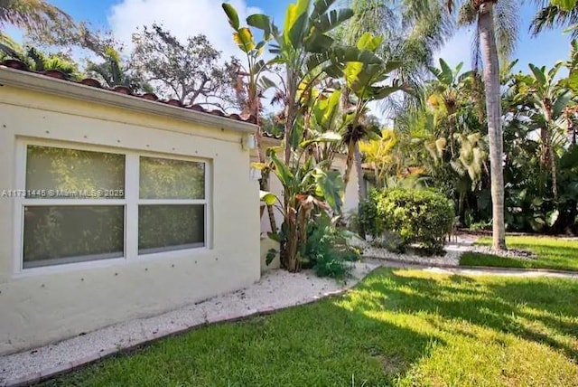 view of property exterior featuring a yard