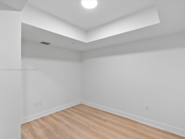 empty room with hardwood / wood-style floors