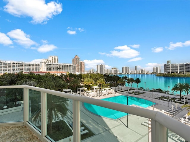 view of swimming pool with a water view