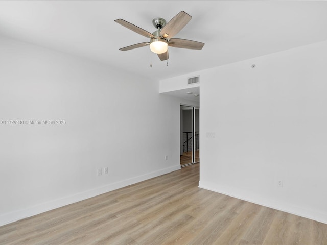 unfurnished room with ceiling fan and light hardwood / wood-style floors