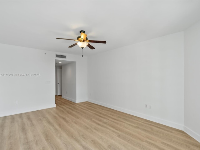 empty room with light hardwood / wood-style flooring and ceiling fan