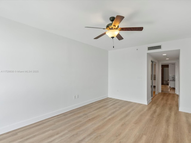 unfurnished room featuring ceiling fan and light hardwood / wood-style floors