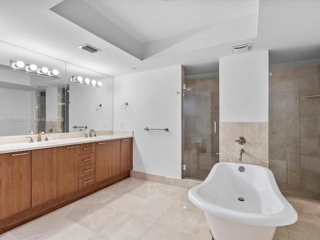 bathroom with vanity and separate shower and tub