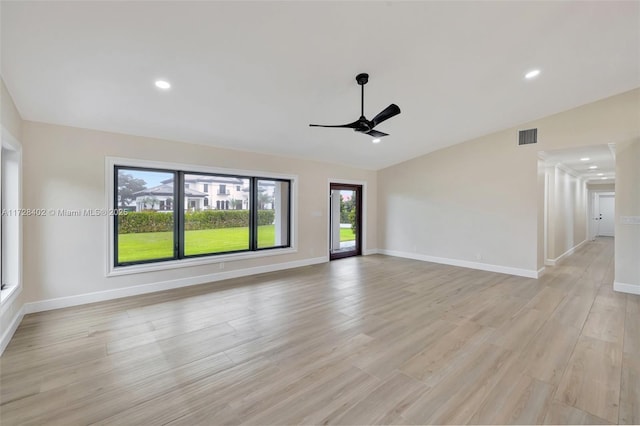 unfurnished living room with lofted ceiling, light hardwood / wood-style floors, and ceiling fan