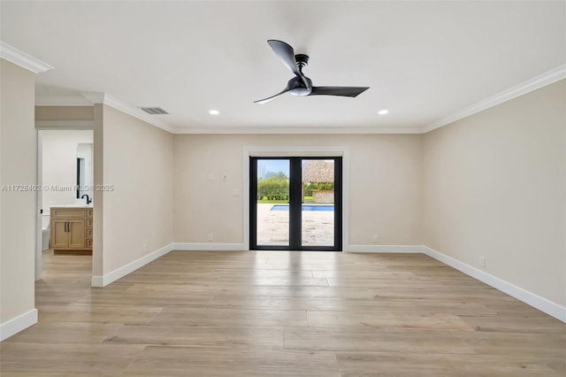 empty room with sink, crown molding, ceiling fan, french doors, and light wood-type flooring