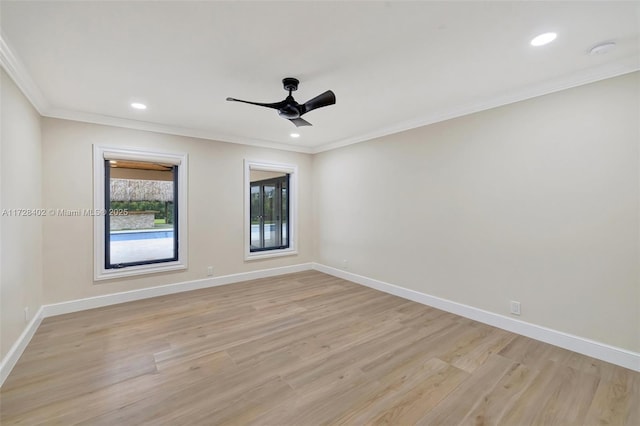 spare room with ceiling fan, ornamental molding, and light hardwood / wood-style flooring