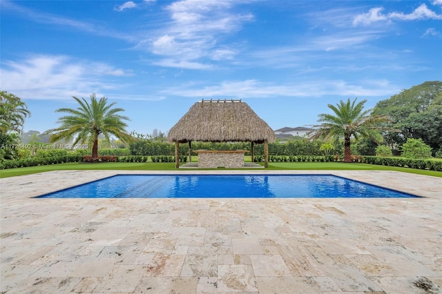 view of pool with a gazebo and a lawn