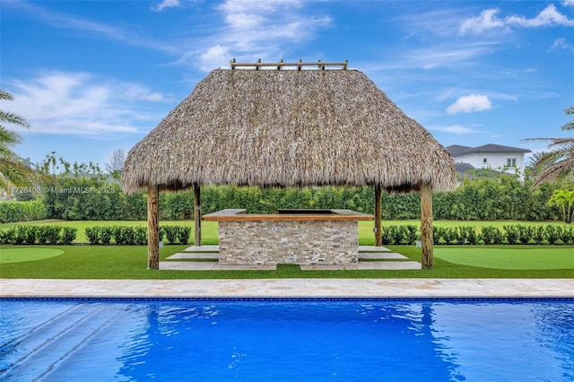 view of pool with a gazebo and a lawn