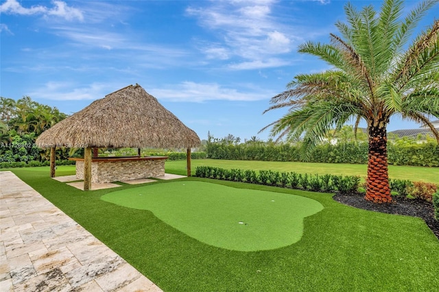 surrounding community featuring a gazebo and a yard