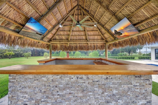 interior space featuring a gazebo and ceiling fan