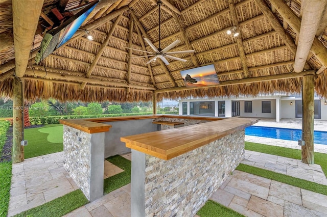 view of patio with a gazebo, an outdoor bar, and ceiling fan