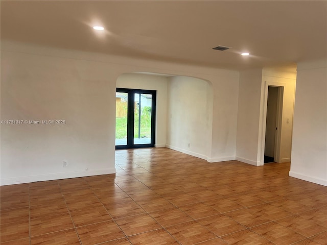 empty room featuring tile patterned floors