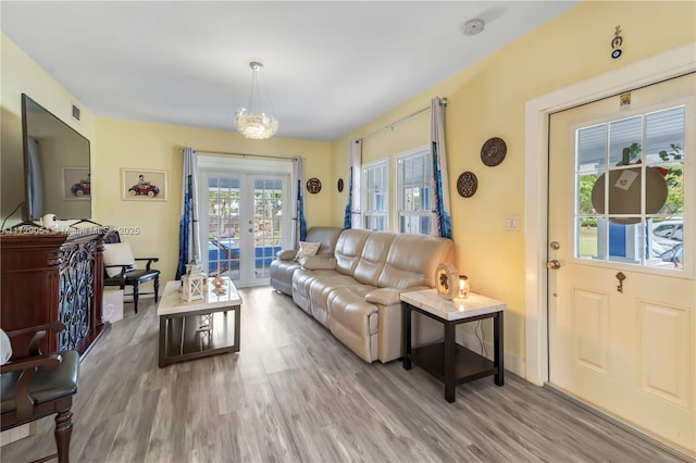 living room with hardwood / wood-style floors and french doors