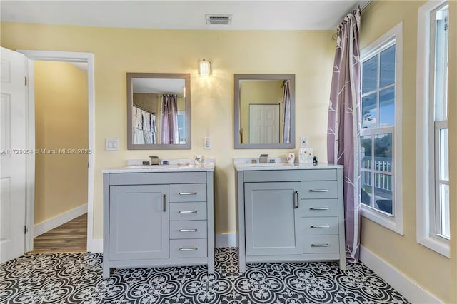 bathroom with vanity and tile patterned floors