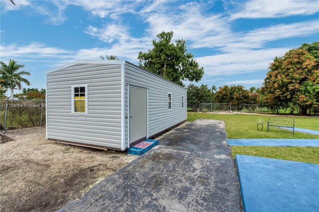 view of outdoor structure featuring a yard